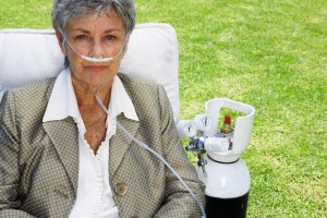 Senior Woman with Oxygen Tank and Breathing Tube